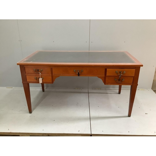 57 - A reproduction cherry kneehole desk with green leather inset top, width 150cm, depth 74cm, height 76... 