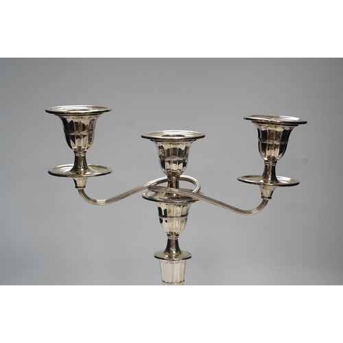 825 - A late Victorian silver two branch, three light candelabrum, Edward Hutton, London, 1891, height 30.... 