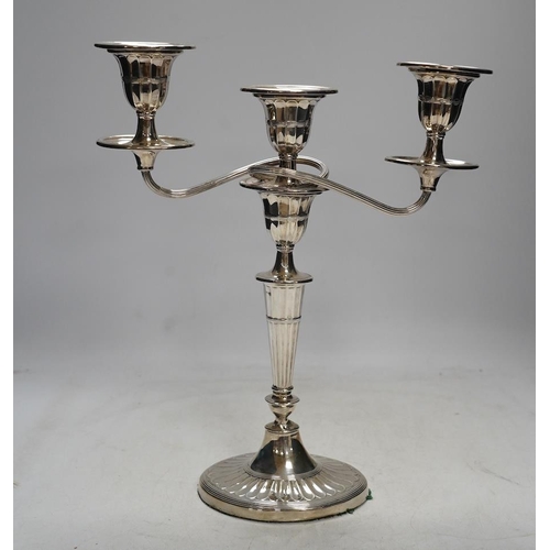 825 - A late Victorian silver two branch, three light candelabrum, Edward Hutton, London, 1891, height 30.... 