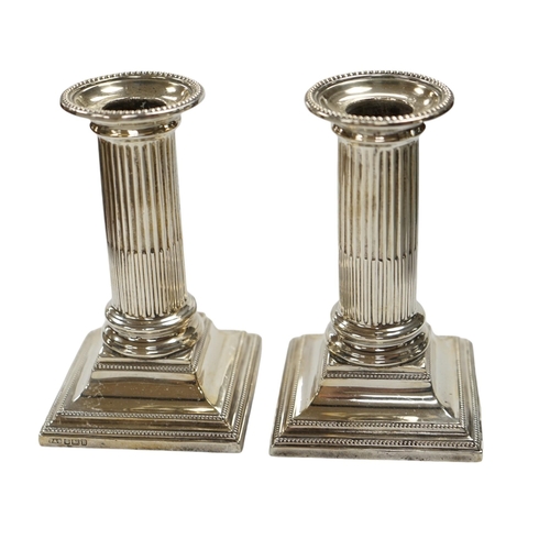 826 - A pair of Edwardian silver dwarf candlesticks, Thomas A. Scott, Sheffield, 1905, height 12.5cm, weig... 