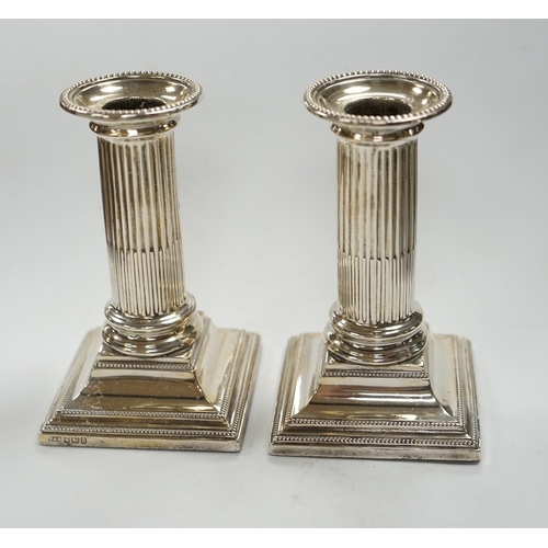 826 - A pair of Edwardian silver dwarf candlesticks, Thomas A. Scott, Sheffield, 1905, height 12.5cm, weig... 