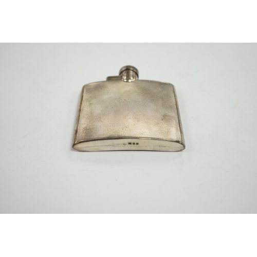 829 - A George VI engine turned silver hip flask, Goldsmiths & Silversmiths Co Ltd, London, 1937, 95mm. Co... 