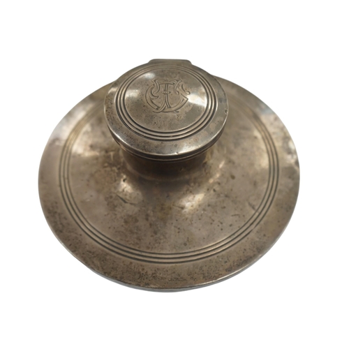 830 - A George V silver mounted capstan inkwell, Birmingham, 1910, base diameter 15.2cm. Condition - poor ... 