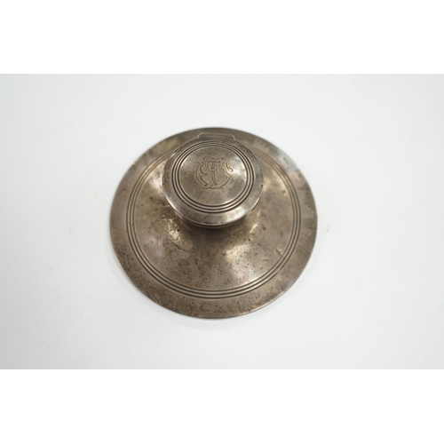 830 - A George V silver mounted capstan inkwell, Birmingham, 1910, base diameter 15.2cm. Condition - poor ... 