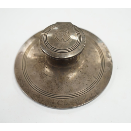 830 - A George V silver mounted capstan inkwell, Birmingham, 1910, base diameter 15.2cm. Condition - poor ... 