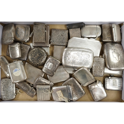 831 - A collection of twenty four assorted silver vesta cases, eight cigarette cases, two match sleeves an... 