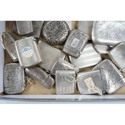 831 - A collection of twenty four assorted silver vesta cases, eight cigarette cases, two match sleeves an... 