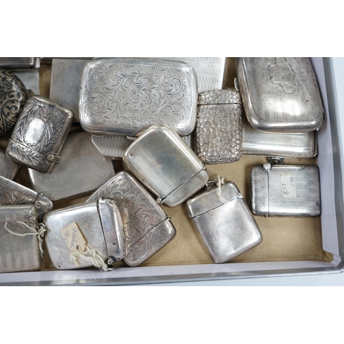 831 - A collection of twenty four assorted silver vesta cases, eight cigarette cases, two match sleeves an... 