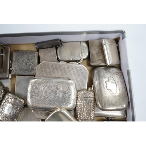 831 - A collection of twenty four assorted silver vesta cases, eight cigarette cases, two match sleeves an... 