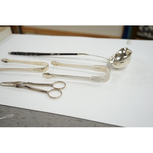 835 - A pair of George V silver grape scissors, by William Hutton & Sons, two pairs of silver sugar tongs ... 