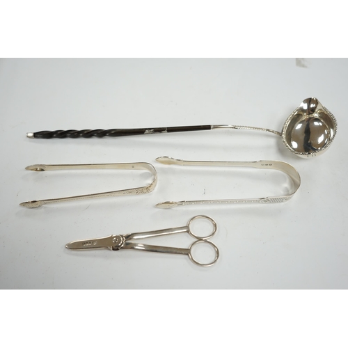 835 - A pair of George V silver grape scissors, by William Hutton & Sons, two pairs of silver sugar tongs ... 