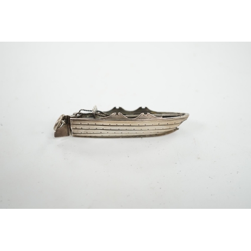 837 - A Sampson Mordan and Co white metal novelty propelling pencil, modelled as a rowing boat, 60mm. Cond... 