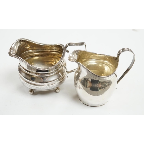 849 - A George III silver helmet shaped cream jug, London, 1806, 10.2cm, together with another George III ... 