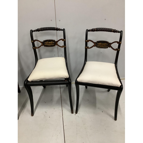 85 - Two Regency mahogany and rosewood elbow chairs together with two Regency ebonised dining chairs. Con... 