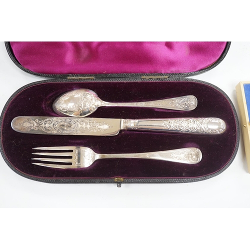 854 - A late Victorian cased chased silver christening trio, London, 1897/90, together with a pair of engr... 