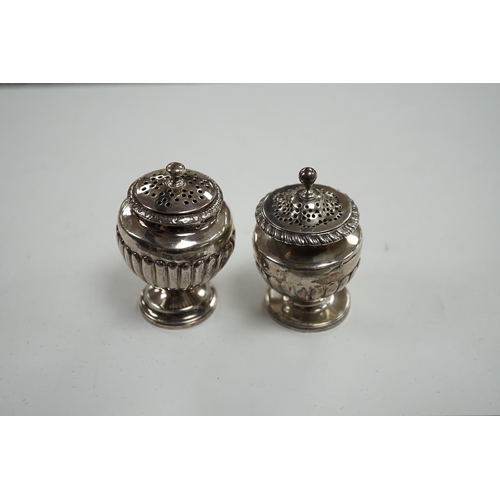 856 - A George III silver pedestal pepper pot, by Eames & Barnard, London, 1816, 75mm and one other simila... 