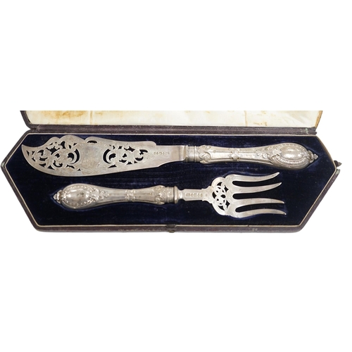 869 - A cased pair of Victorian silver fish servers, Atkin Brothers, Sheffield, 1861, knife 32.4cm. Condit... 