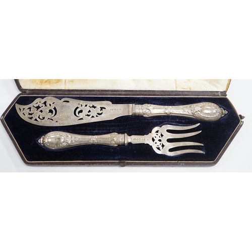 869 - A cased pair of Victorian silver fish servers, Atkin Brothers, Sheffield, 1861, knife 32.4cm. Condit... 