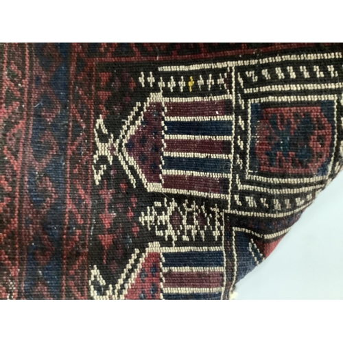 87 - A Baluch prayer rug, 130 x 78cm. Condition - poor