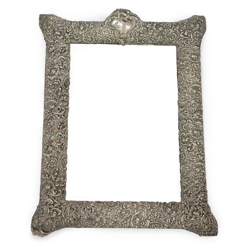 873 - A very large Victorian repousse silver mounted easel dressing table mirror, by Goldsmiths & Silversm... 