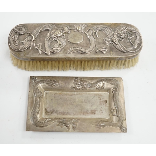 878 - A Chinese white metal brush inscribed 'Presented by the Hokow Foreign Outdoor Staff 1911' and a simi... 