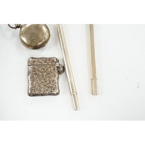 879 - A George V silver sovereign case, a silver vesta case and two silver propelling pencils. Condition -... 