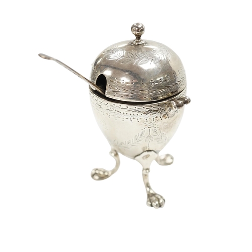 880 - A Victorian silver egg shaped mustard pot, on paw feet, London, 1867, 10.5cm, with an earlier silver... 