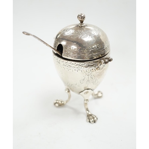 880 - A Victorian silver egg shaped mustard pot, on paw feet, London, 1867, 10.5cm, with an earlier silver... 