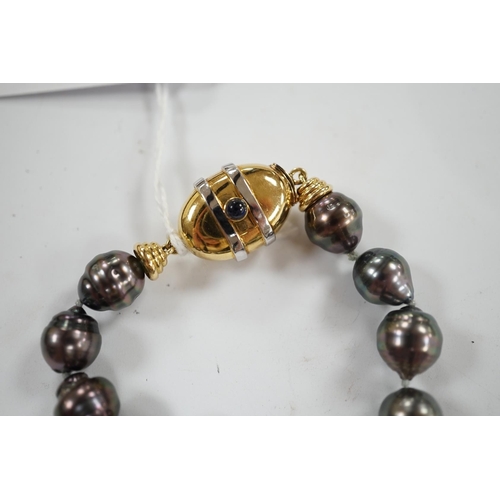 901 - A  modern single strand graduated Tahitian baroque cultured pearl necklace, with cabochon set yellow... 