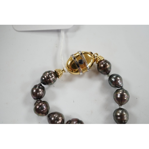 901 - A  modern single strand graduated Tahitian baroque cultured pearl necklace, with cabochon set yellow... 