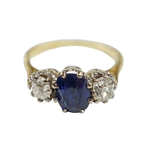 906 - A 1970's 18ct gold, sapphire and diamond set three stone ring, size J/K, gross weight 3.8 grams. Con... 