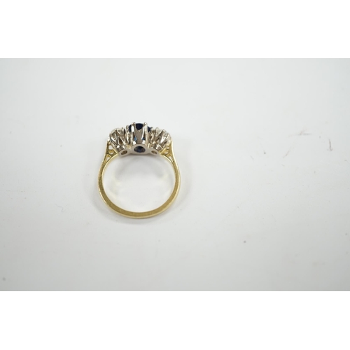 906 - A 1970's 18ct gold, sapphire and diamond set three stone ring, size J/K, gross weight 3.8 grams. Con... 