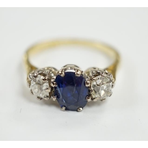 906 - A 1970's 18ct gold, sapphire and diamond set three stone ring, size J/K, gross weight 3.8 grams. Con... 