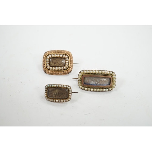 908 - Three assorted 19th century yellow metal and seed pearl set mourning brooches, two with plaited hair... 