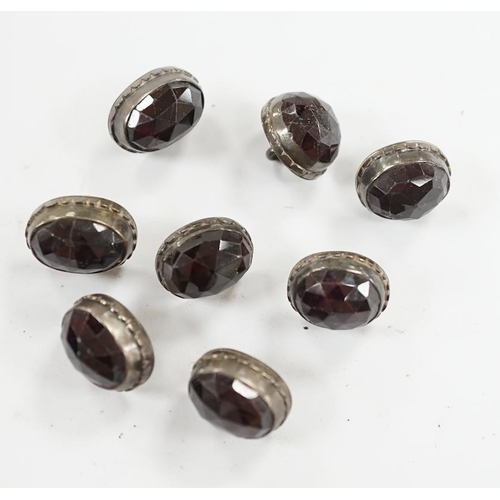 918 - A set of eight 19th century white metal and facetted garnet set buttons, 12mm. Condition - fair but ... 