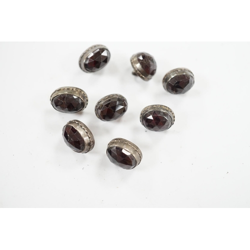 918 - A set of eight 19th century white metal and facetted garnet set buttons, 12mm. Condition - fair but ... 