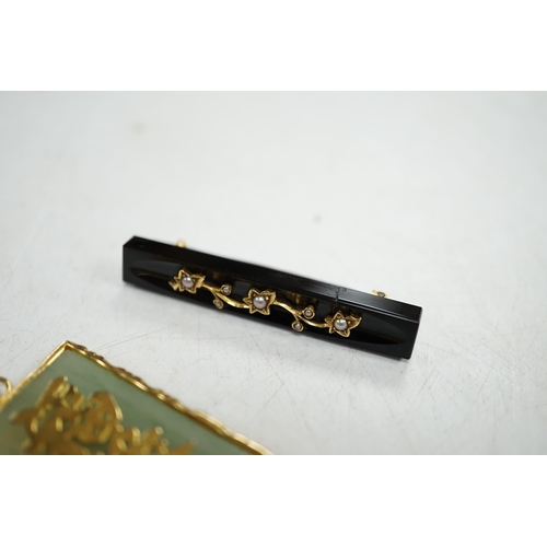 920 - A late Victorian gold mounted black onyx and pearl bar brooch, and a Chinese yellow metal mounted ja... 