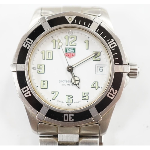 923 - A gentleman's recent stainless steel Tag Heuer Professional quartz wrist watch, no box or papers. Co... 