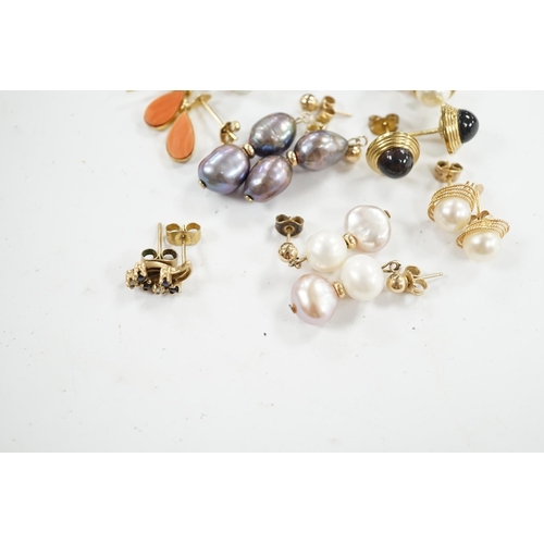 934 - Seven assorted modern pairs of 9ct and gem set earrings and two similar yellow metal pairs. Conditio... 