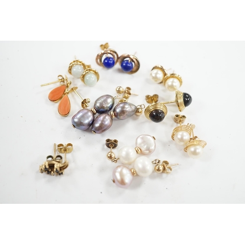 934 - Seven assorted modern pairs of 9ct and gem set earrings and two similar yellow metal pairs. Conditio... 