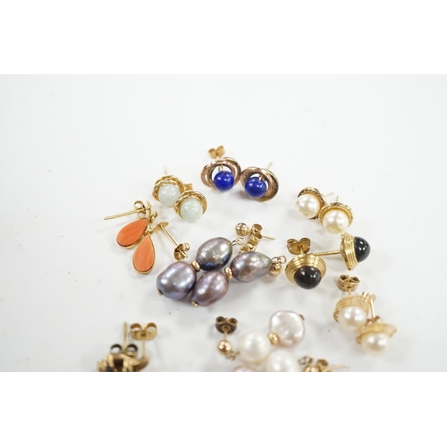 934 - Seven assorted modern pairs of 9ct and gem set earrings and two similar yellow metal pairs. Conditio... 