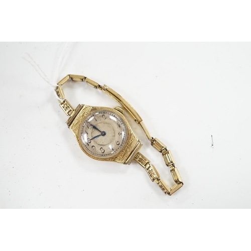 937 - A lady's 14k manual wind wrist watch, with Arabic dial and engraved case, on a gold plated bracelet.... 