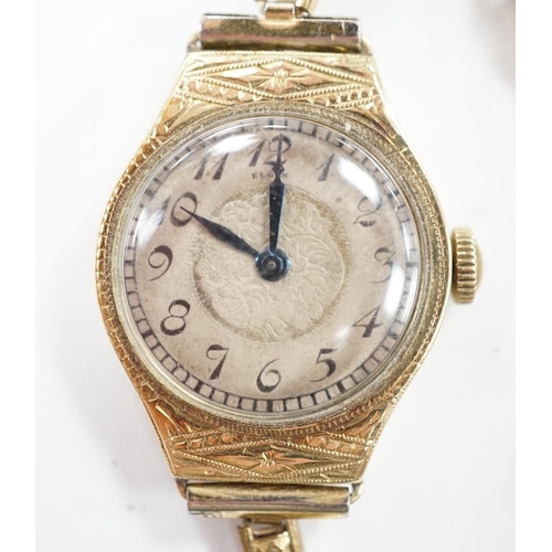 937 - A lady's 14k manual wind wrist watch, with Arabic dial and engraved case, on a gold plated bracelet.... 