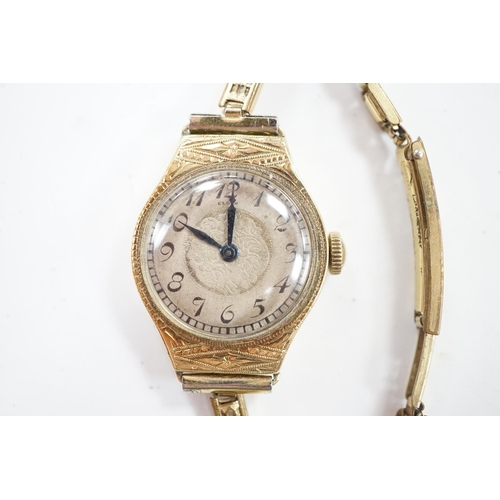 937 - A lady's 14k manual wind wrist watch, with Arabic dial and engraved case, on a gold plated bracelet.... 