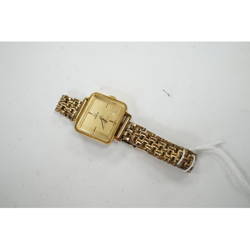 944 - A lady's steel and gold plated Omega De Ville manual wind wrist watch, on an associated gold plated ... 