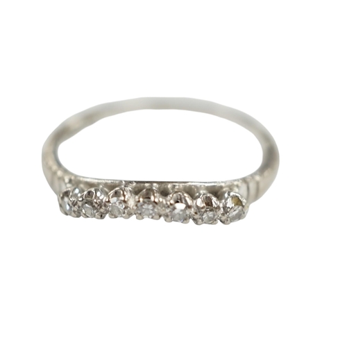 949 - An 18ct, plat and seven stone diamond chip set 'chevron' half hoop ring, size O, gross weight 2.5 gr... 