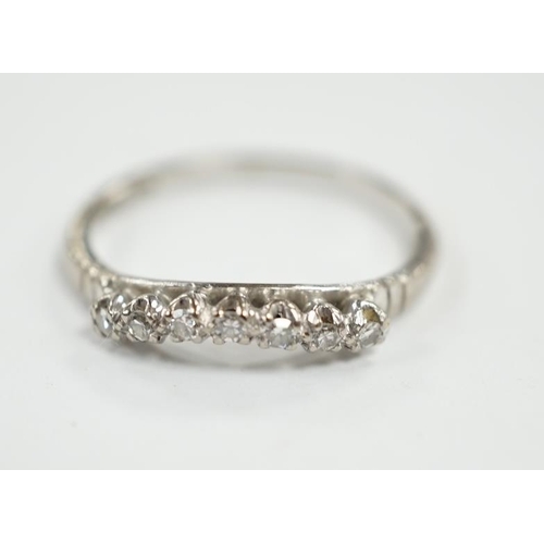 949 - An 18ct, plat and seven stone diamond chip set 'chevron' half hoop ring, size O, gross weight 2.5 gr... 