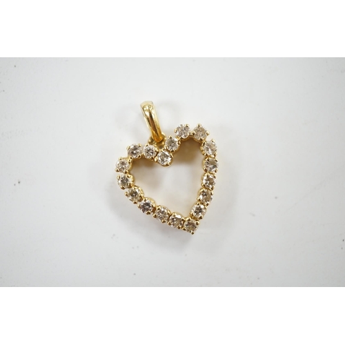 950 - A modern 18k and diamond cluster set open work heart shaped pendant, overall 21mm, gross weight 2.7 ... 