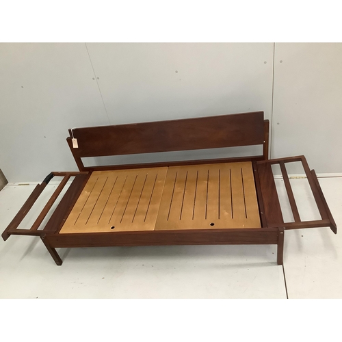 1005 - A mid century Robin Day style teak sofa bed, width 149cm, depth 72cm, height 68cm. Condition - poor... 