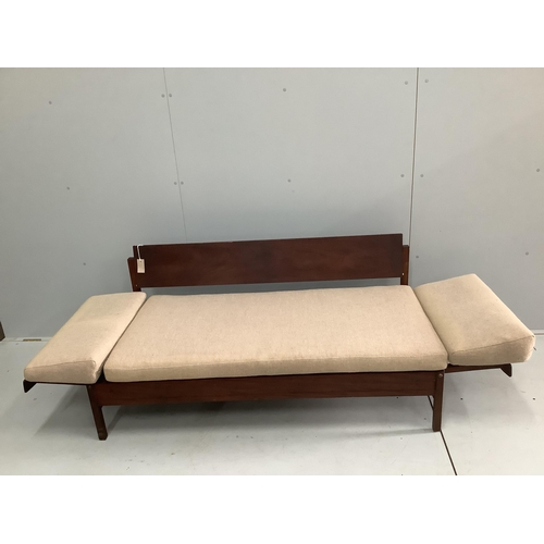 1005 - A mid century Robin Day style teak sofa bed, width 149cm, depth 72cm, height 68cm. Condition - poor... 